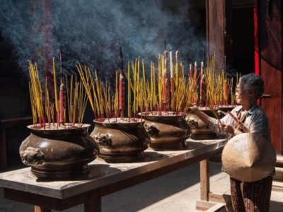 An-unidentified-woman-prays-in-a-temple